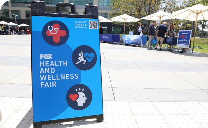 FOX Health and Wellness Fair display outside on a sunny day.